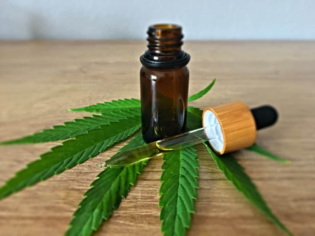 CBD oil in brown bottle - featured image