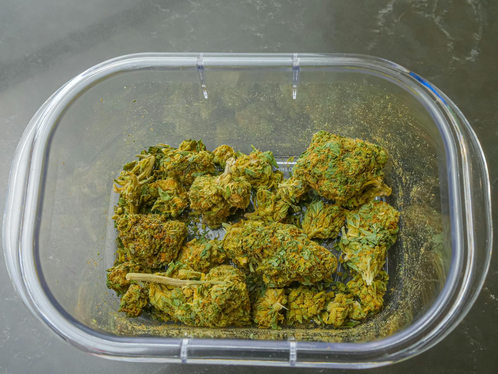 cannabis flower on a glass container